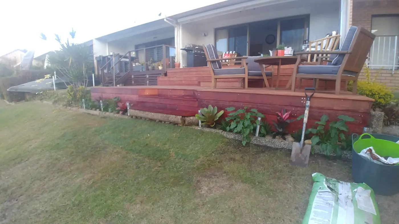Hardwood deck with layered steps and new garden bed