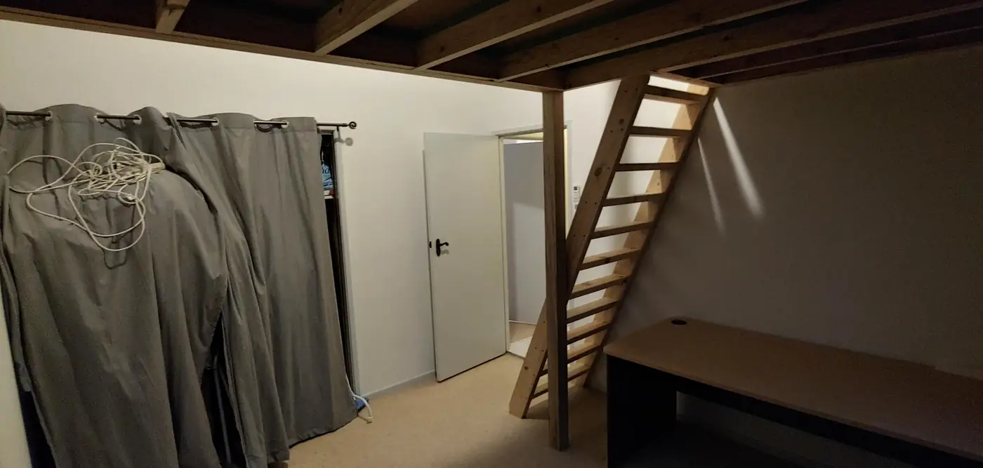 Timber loft and staircase built into a bedroom