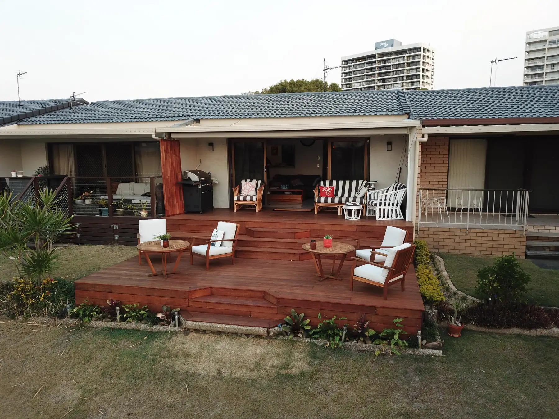 Two-level hardwood deck with built-in steps, built by Handy Mark