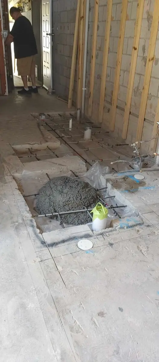 Section of slab cut out, mesh in, concrete going in