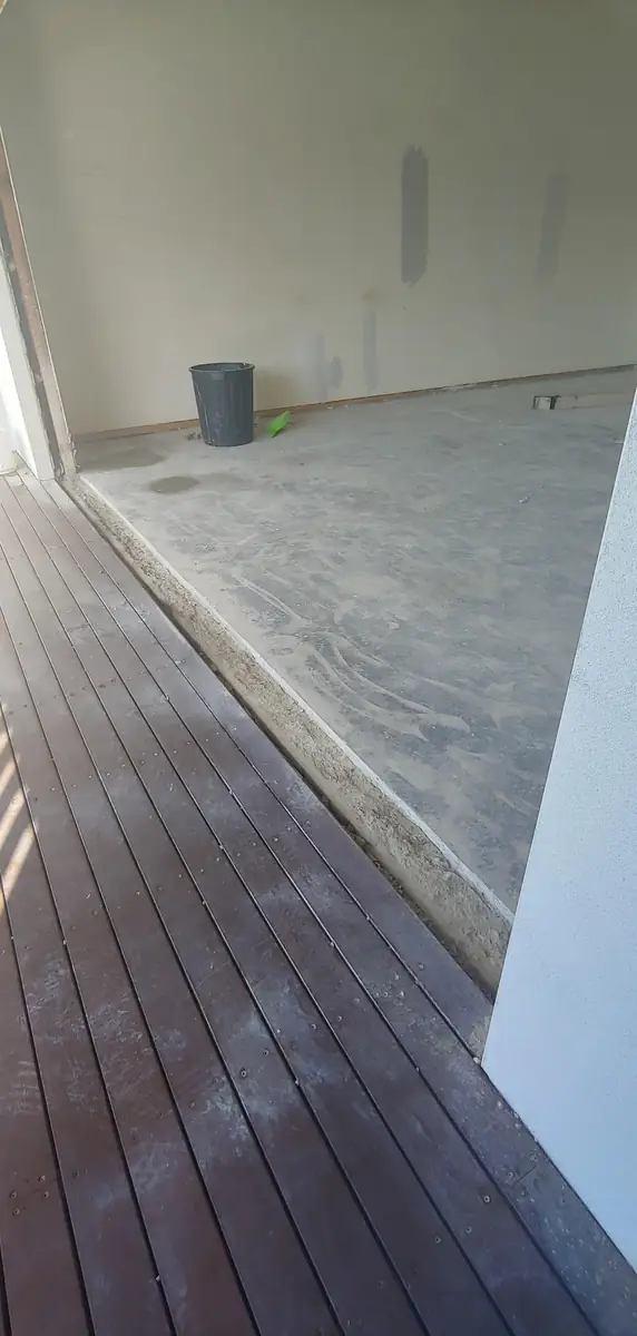 Deck boards finishing flush with the new floor level at the opening