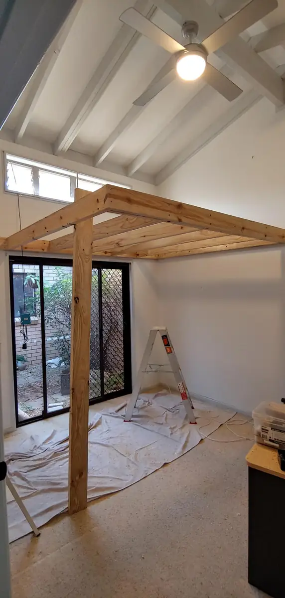 Timber stairs up to the loft