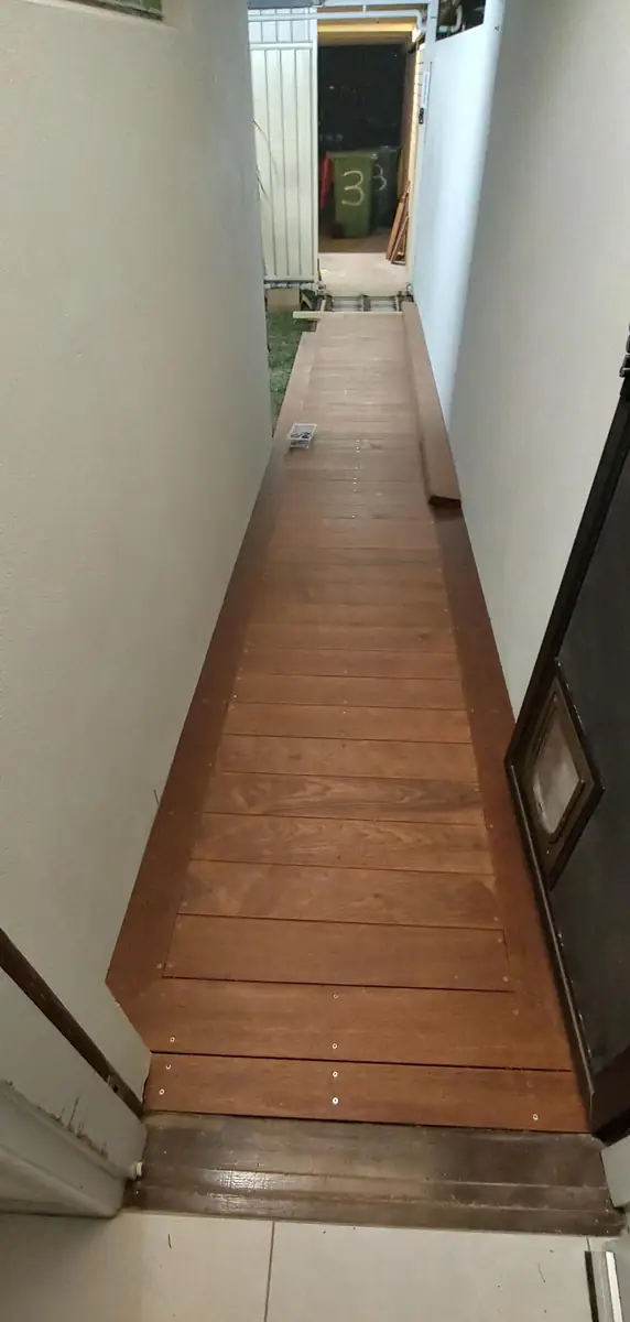 Hardwood boards going down along the walkway